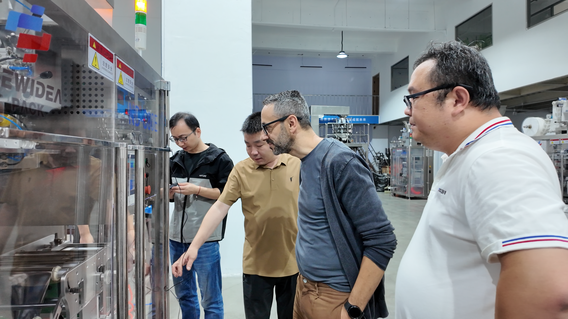 Staff training session on how to follow a packaging machinery maintenance checklist